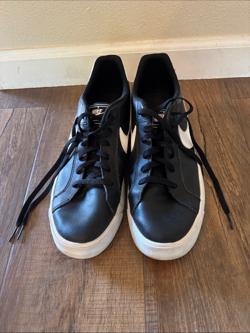Nike Men’s Black Sneakers with White Swoosh Accents